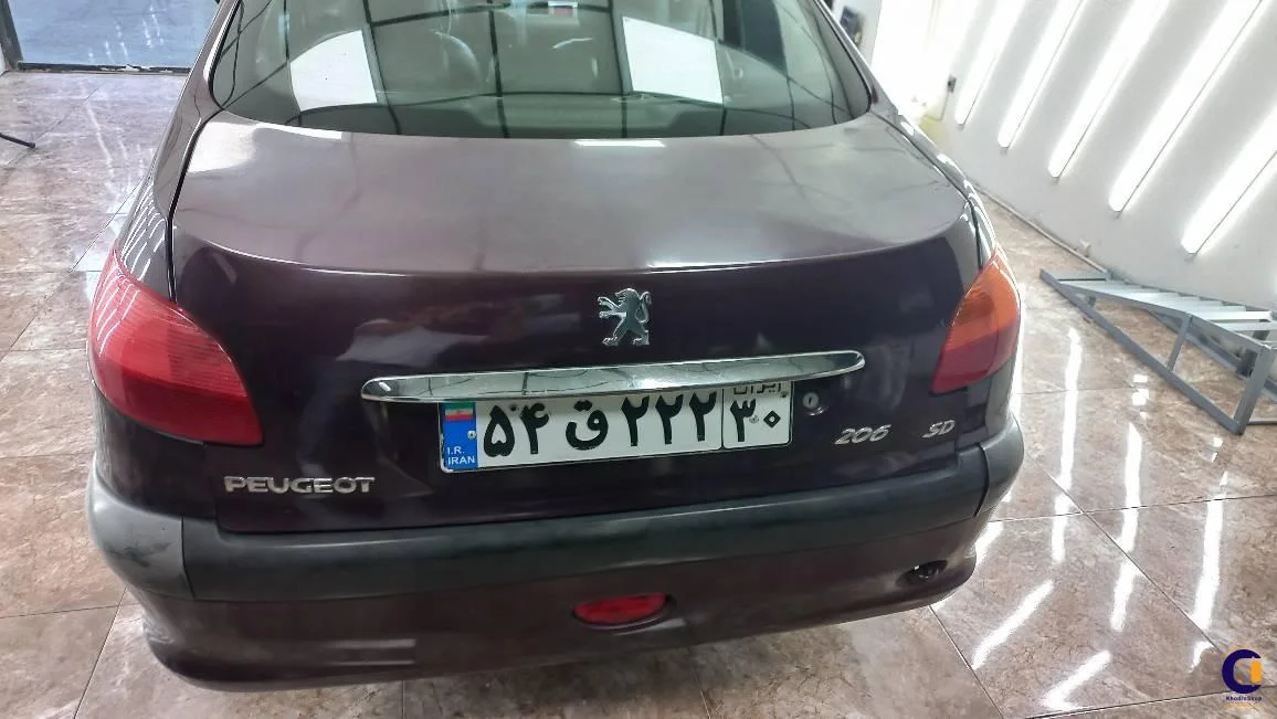 نمای 2 از خرید پژو 206 SD V8 مدل 2010-1389 مدل 2010-1389 رنگ بادمجانی نقدی و اقساطی در خودروشاپ